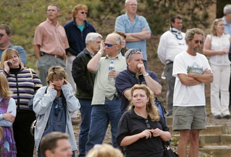 Anxious parents wait for students to be released from the Platte Canyon High School in Bailey, Colorado, September 27, 2006, after shots were fired at the school and hostages taken. 
